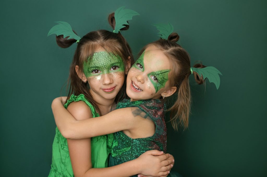 Girlfriends in the image of green dragon - the symbol of 2024 new year